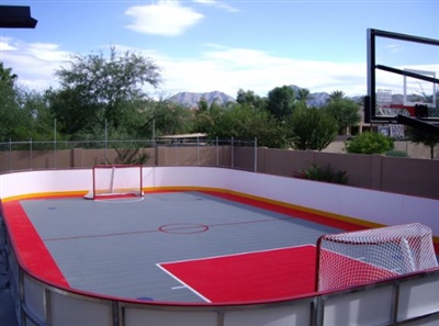 An outdoor multi-purpose court with hockey goals and a basketball hoop in Jordan.