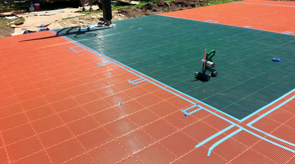 Preperation to paint basketball court lines on Sport Court tiles.